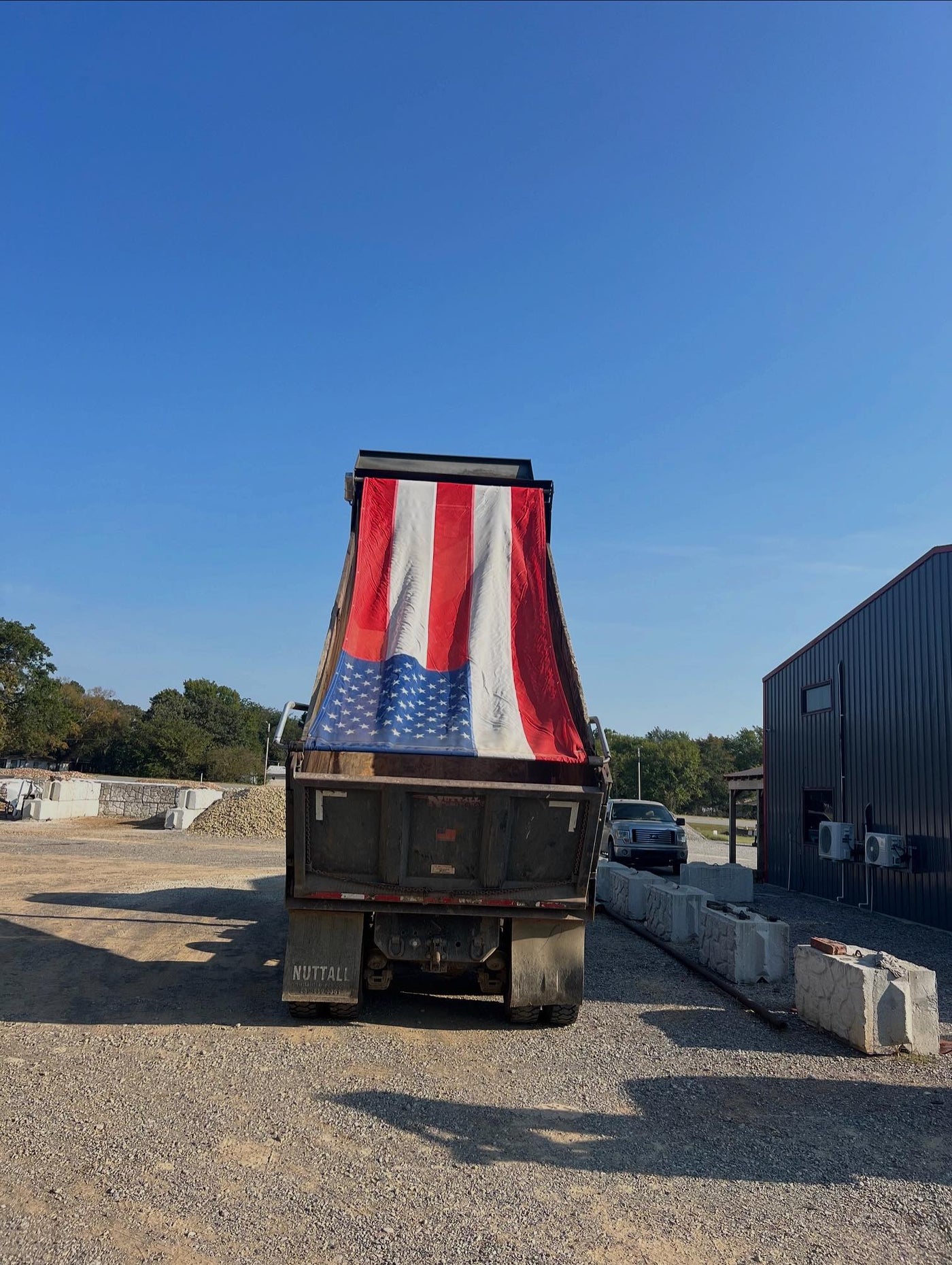 Mesh American Flag Tarp installed on a Customer's Dump Truck