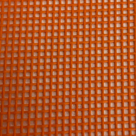 Close-up view of a heavy-duty orange mesh tarp made of UV-resistant polyester, featuring a pattern of square openings.