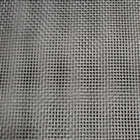 Close-up view of a black mesh dump truck tarp showing the weave pattern and texture.