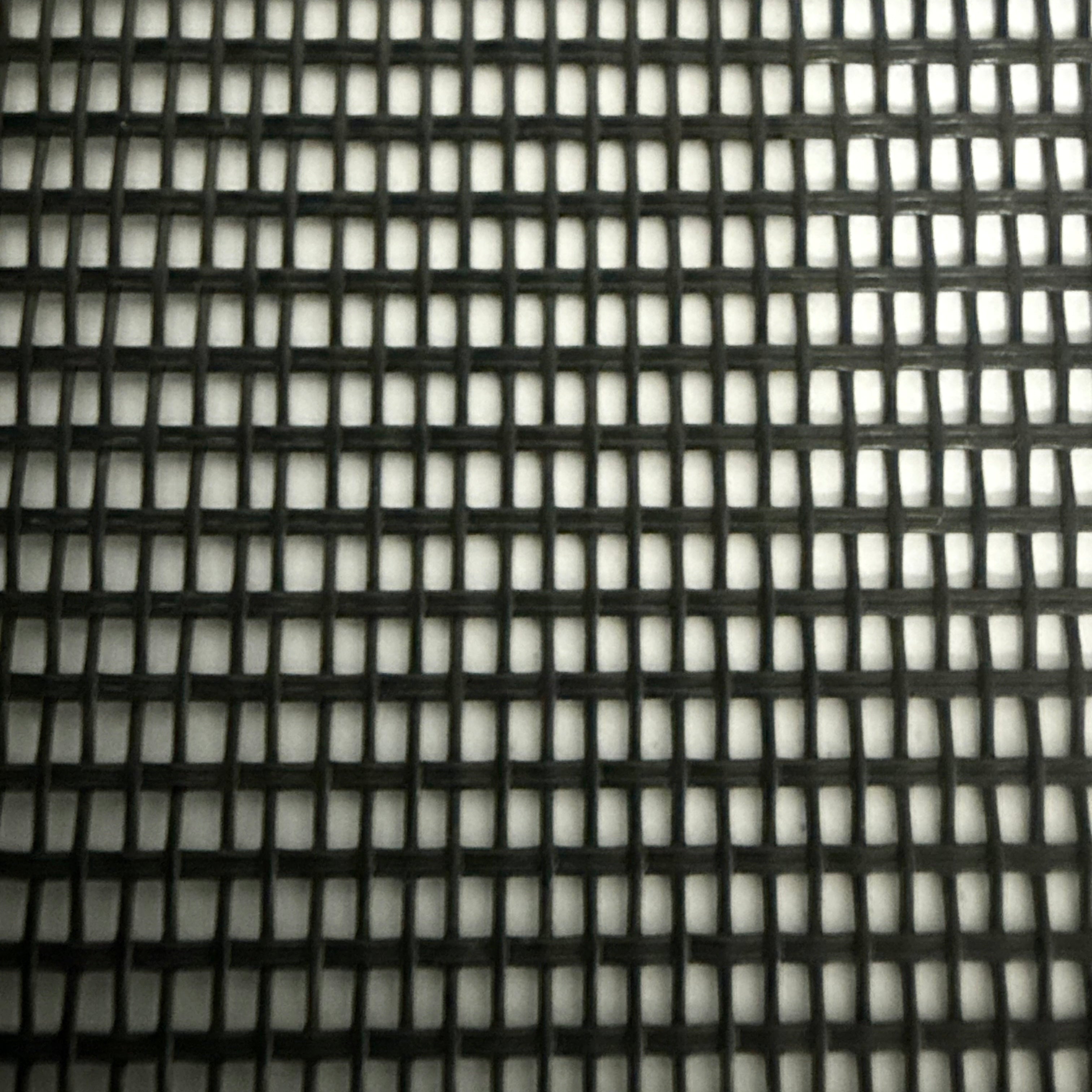 Close-up of a black mesh material sample