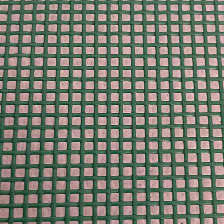 Close-up view of a heavy-duty green mesh tarp made of UV-resistant polyester, featuring a pattern of square openings.