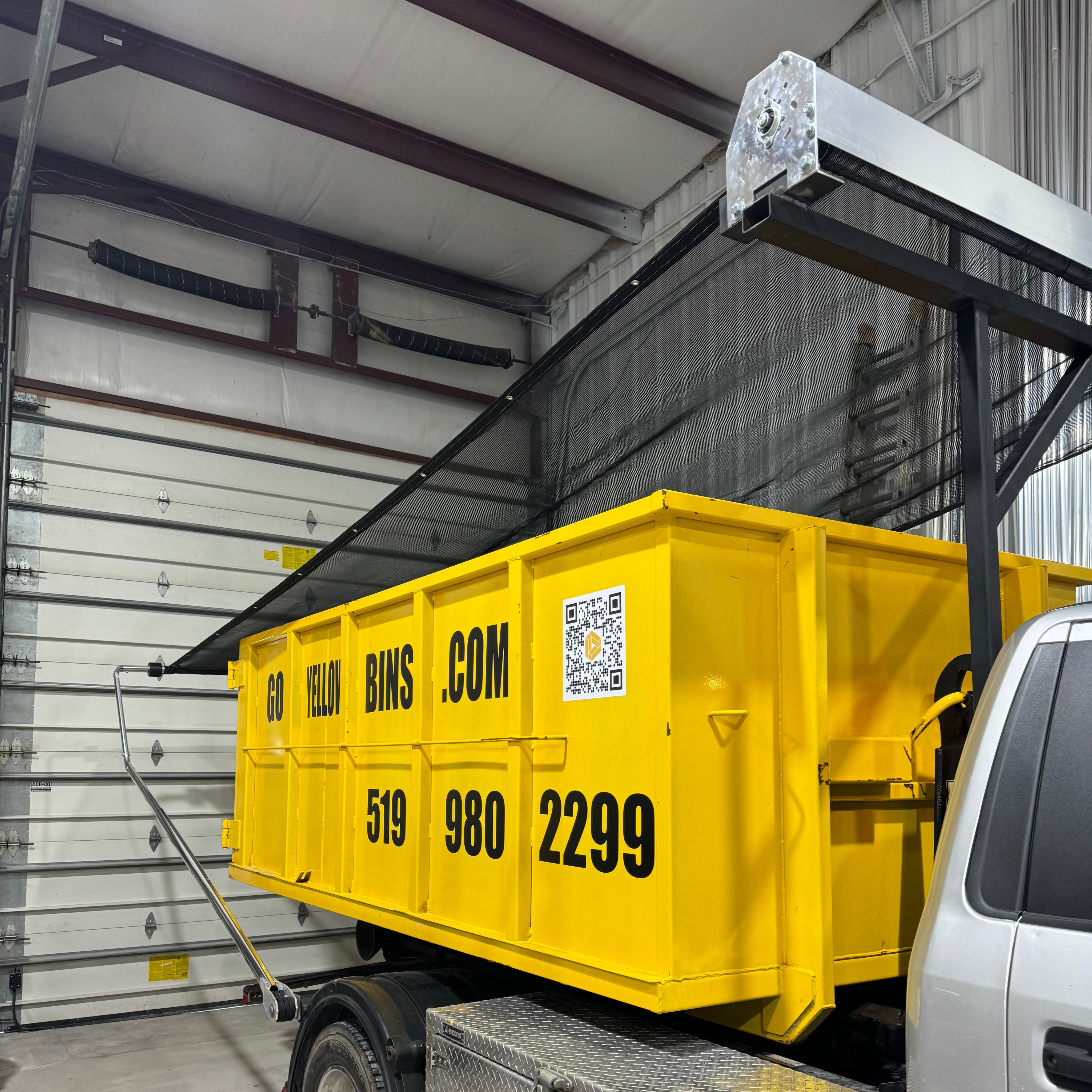 Patriot Aluminum Electric Tarping System installed by a customer with a stationary gantry and tarp arm bends.